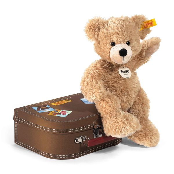 STEIFF - Bear Fynn 28 cm en una maleta marrón